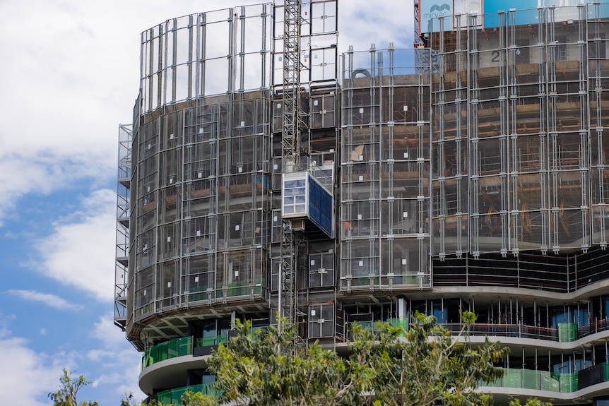Photos of a multi-residential tower being constructed.