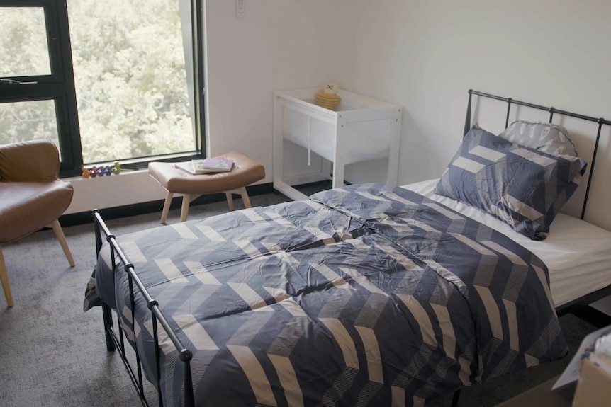 A bedroom in an apartment building.