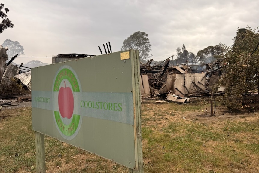 brnt out runs sit behind the sign for Harcourt Coolstores