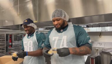 Philadelphia Eagles players pack meals for those in need while preparing for playoffs to begin