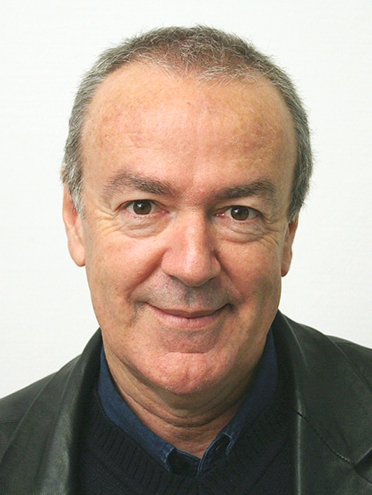 A headshot of Simon Chapman