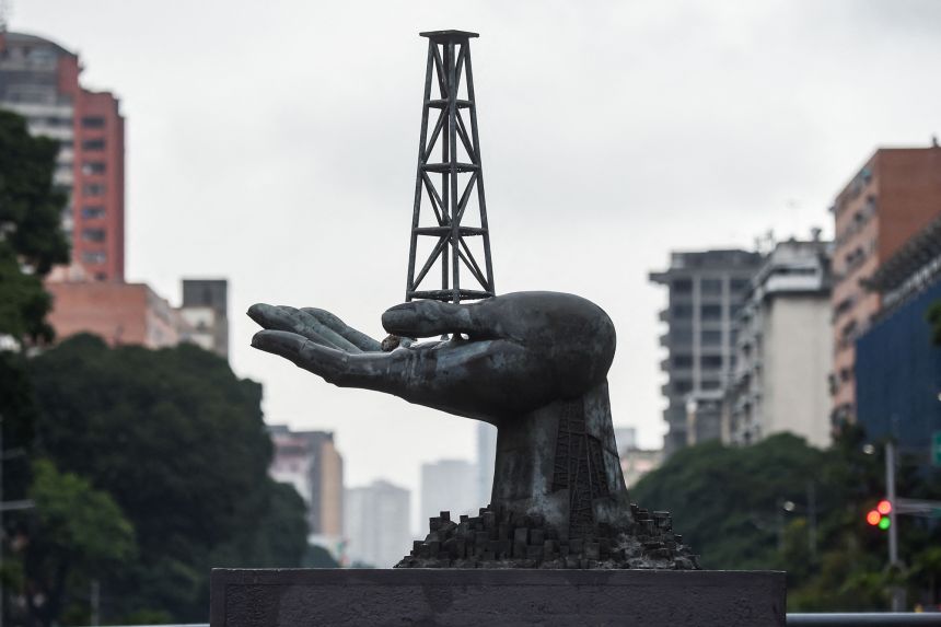 View of the Peace Monument sculpture in front of the Petroleos de Venezuela (PDVSA) headquarters in Caracas, on December 2, 2022.