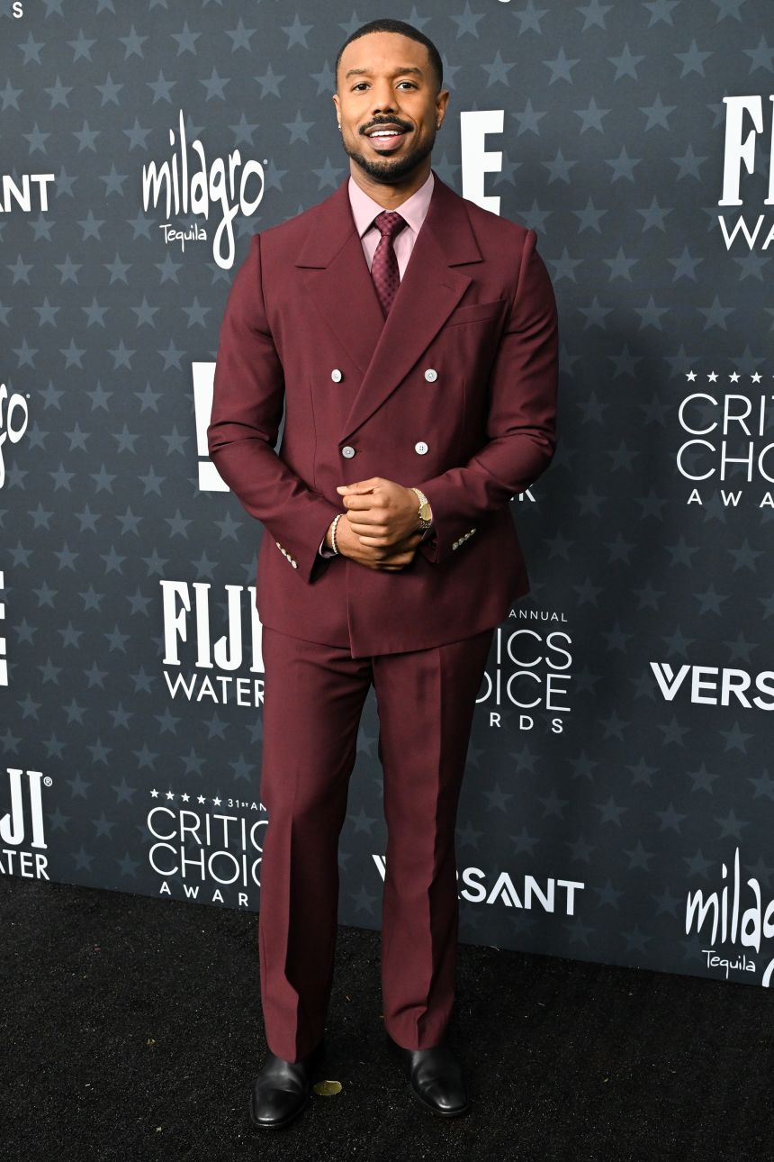 Best Actor nominee Michael B. Jordan in a burgundy double breasted Louis Vuitton suit.