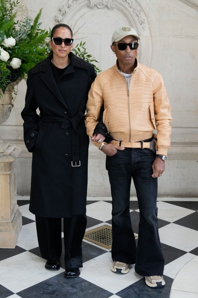 Helen Lasichanh and Pharrell Williams attend the Christian Dior Haute Couture show during Paris Fashion Week.
