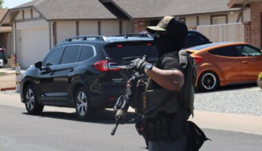 a masked HSI agent with a rifel