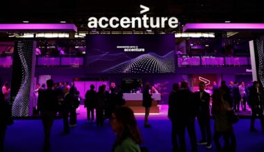 The Accenture logo is displayed above a busy pavilion with people networking and talking.