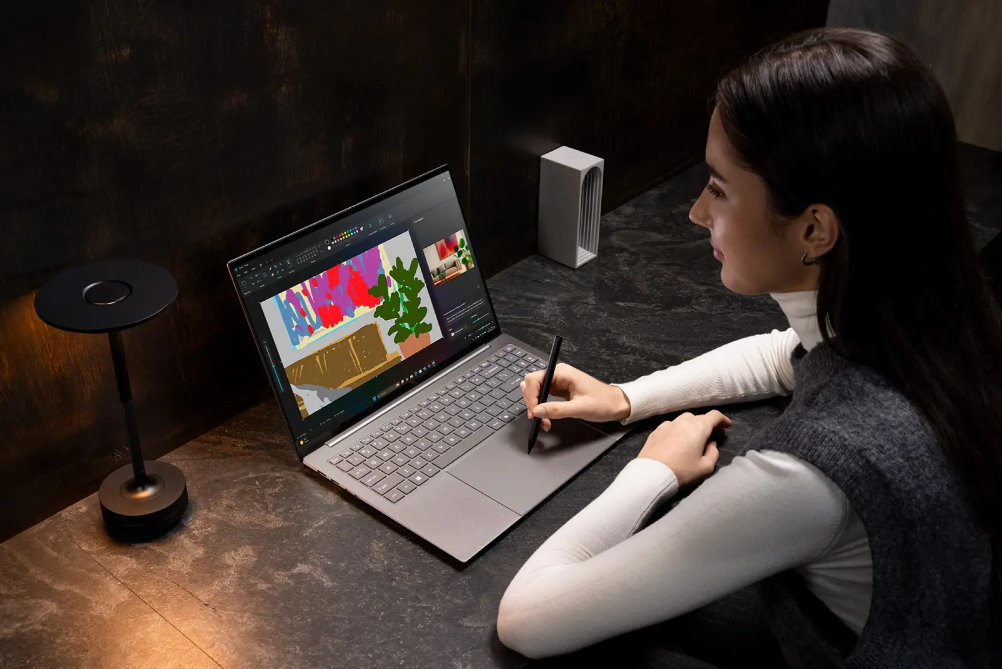 Woman using Acer Swift laptop with a stylus on the very large touchpad