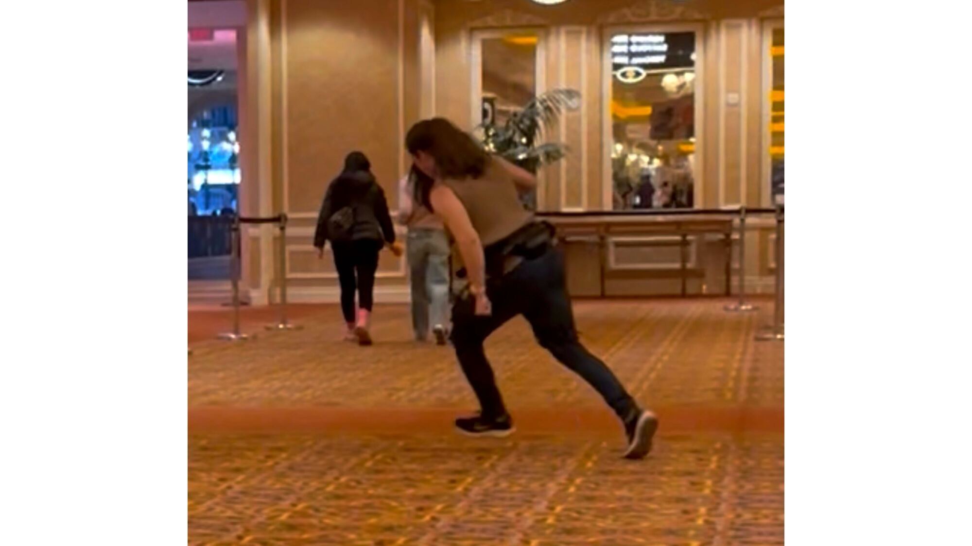 Beth running with an exoskeleton on