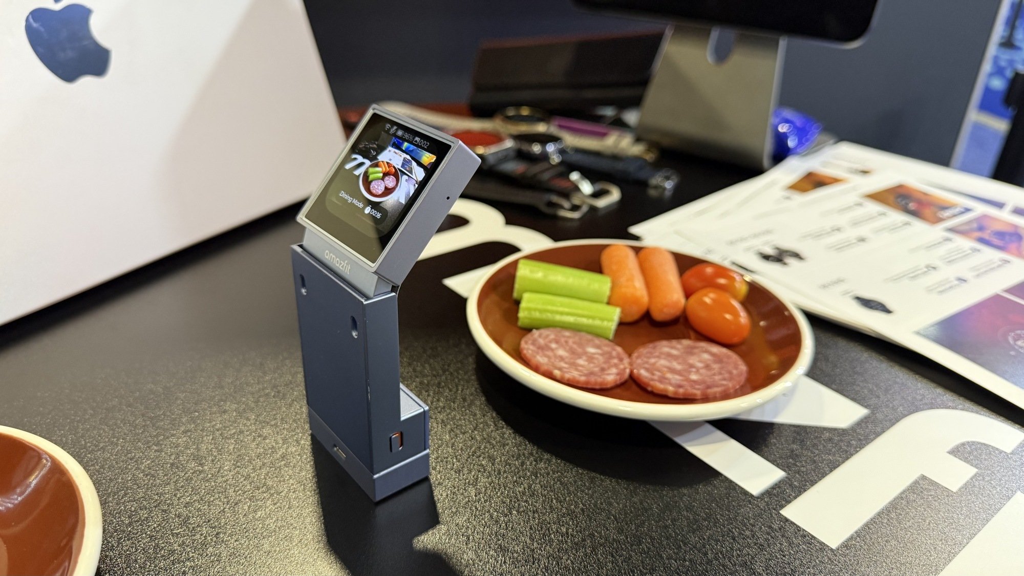 a little camera device taking a photo of food