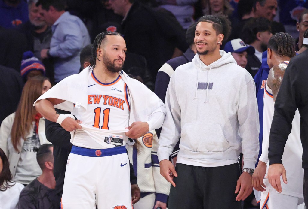 New York Knicks guard Jalen Brunson #11 speaks with New York Knicks guard Josh Hart #3 off the bench during the fourth quarter. 