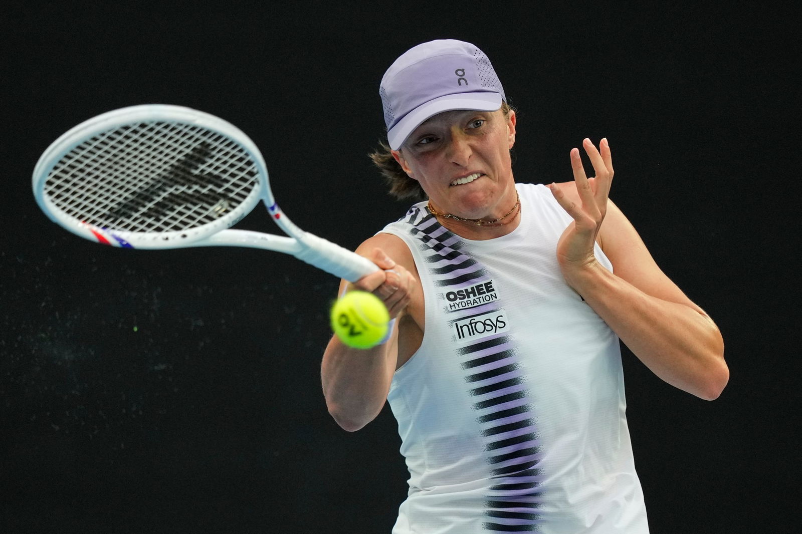 Iga Swiatek hits a forehand shot