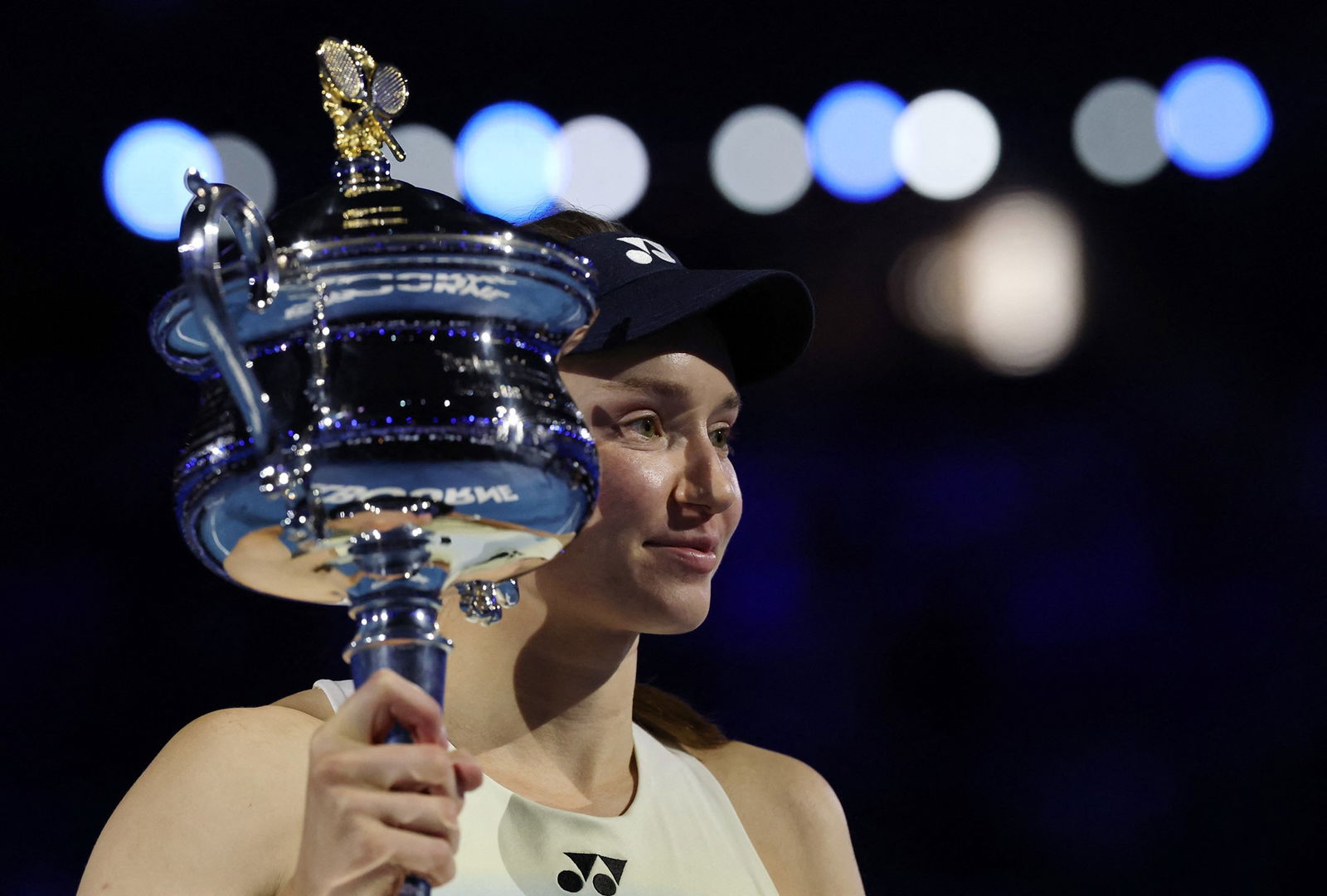 Rybakina holding the AO trophy