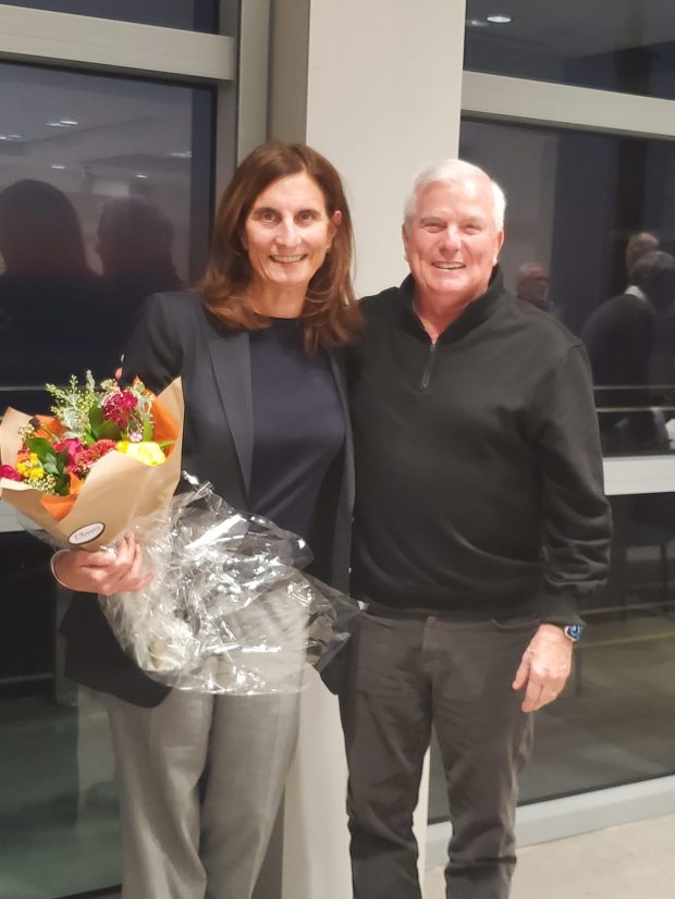 Departing Enhance La Jolla board member Kathryn Kanjo stands with board President Ed Witt. (Ashley Mackin-Solomon)