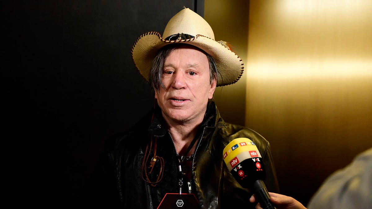 Mickey Rourke wearing a cowboy hat