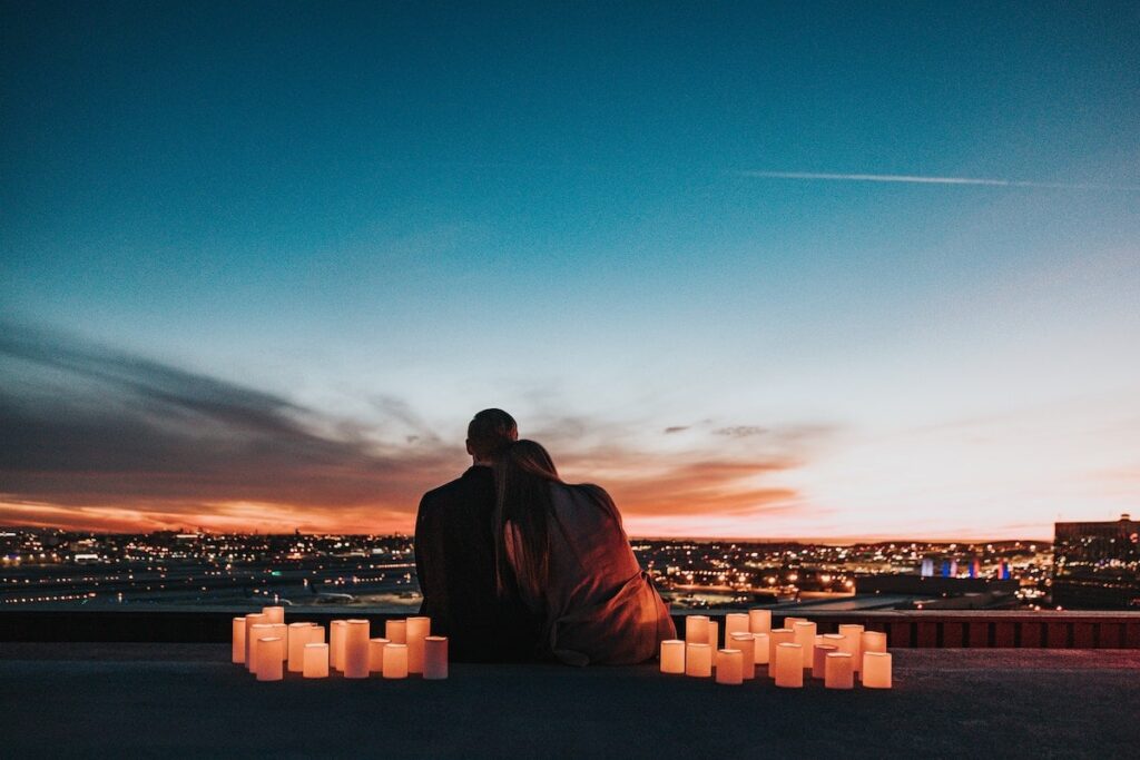 A beautiful sunset shot of a couple taking in Los Angeles cityscape.