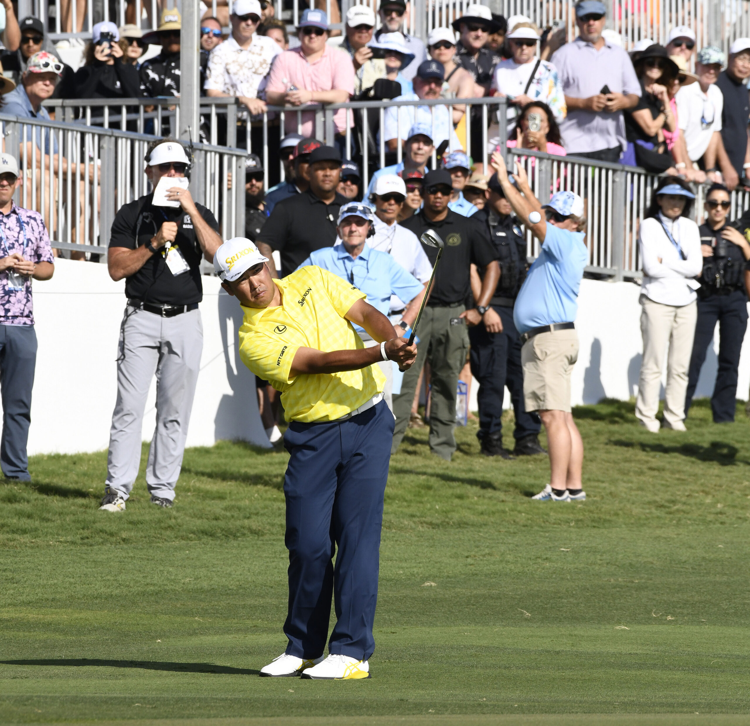 Winner Hideki Matsuyama chips to the 18th green Sunday to set up one last birdie at the Kapalua Plantation Course. His 35-under-par total set a new PGA Tour record. Maui Photojournalism Magazine / MATTHEW THAYER photo