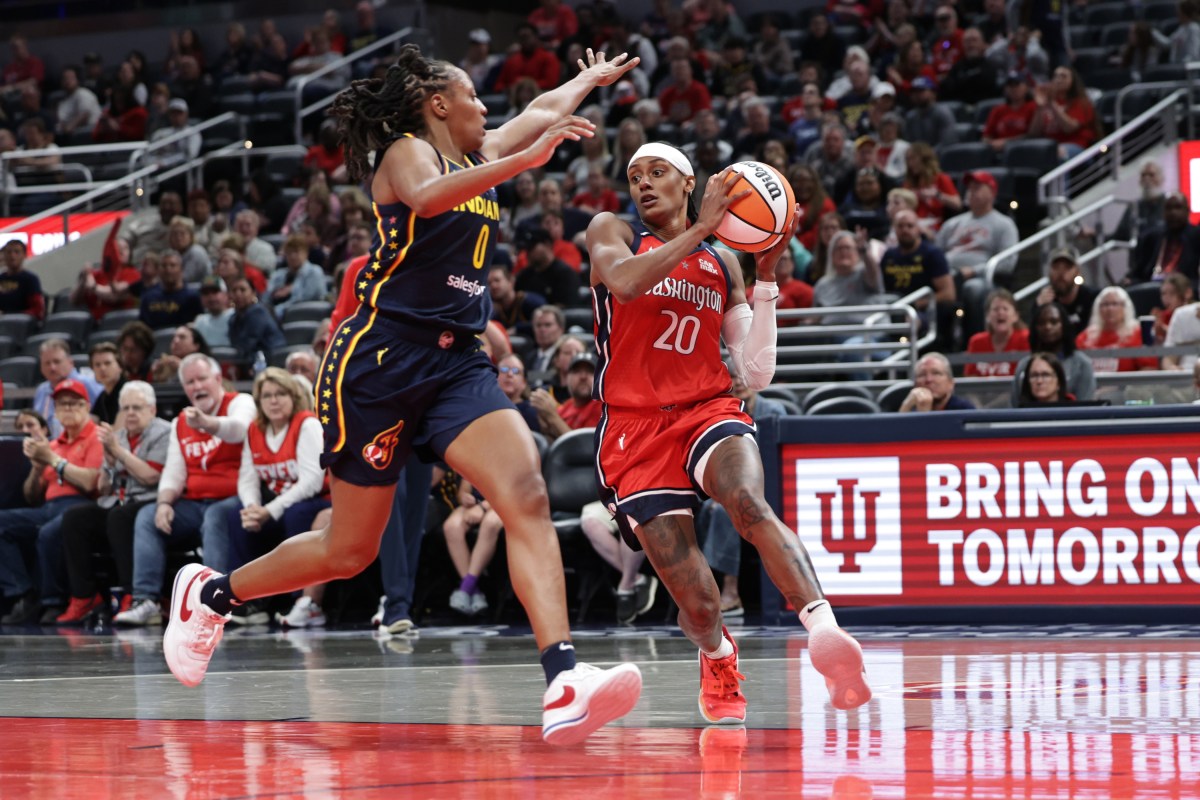 NDIANAPOLIS, INDIANA - MAY 3: Brittney Sykes #20 of the Washington Mystics dribbles past Kelsey Mitchell #0 of the Indiana Fever during the first half at Gainbridge Fieldhouse on May 3, 2025 in Indianapolis, Indiana. N