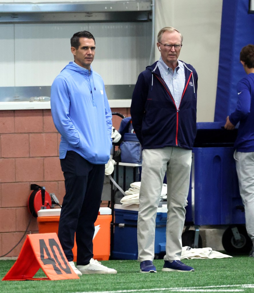 John Mara next to GM Joe Schoen during practice at the New York Giants training facility in East Rutherford, New Jersey.