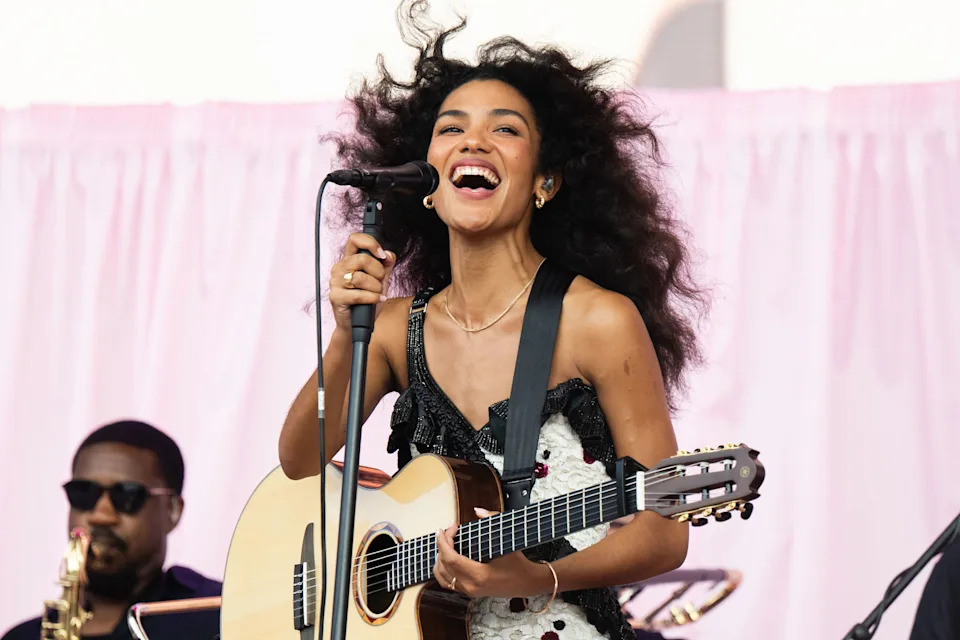 Olivia Dean performs onstage. 