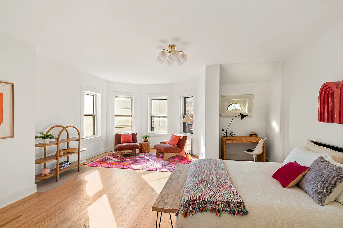 bedroom with windowed bay seating area