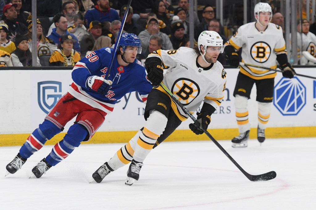 Pavel Zacha #18 of the Boston Bruins skates against Will Cuylle #50 of the New York Rangers at the TD Garden on January 10, 2026 in Boston, Massachusetts. 