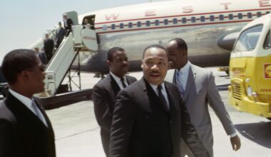 Martin Luther King and his supporters debaord an airplane at Phoenix Sky Harbor Airport in 1964.
