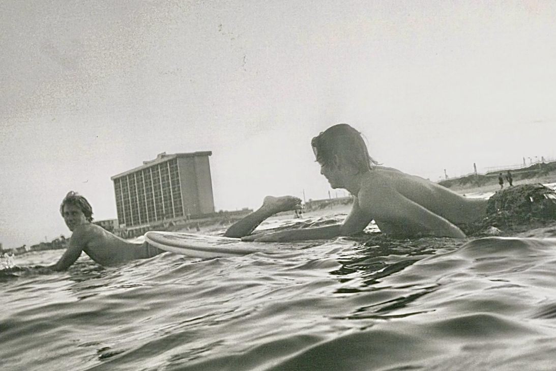 Jake, left, and Chris surfing in Florida in their 20s.