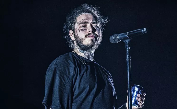 Post Malone performs on stage