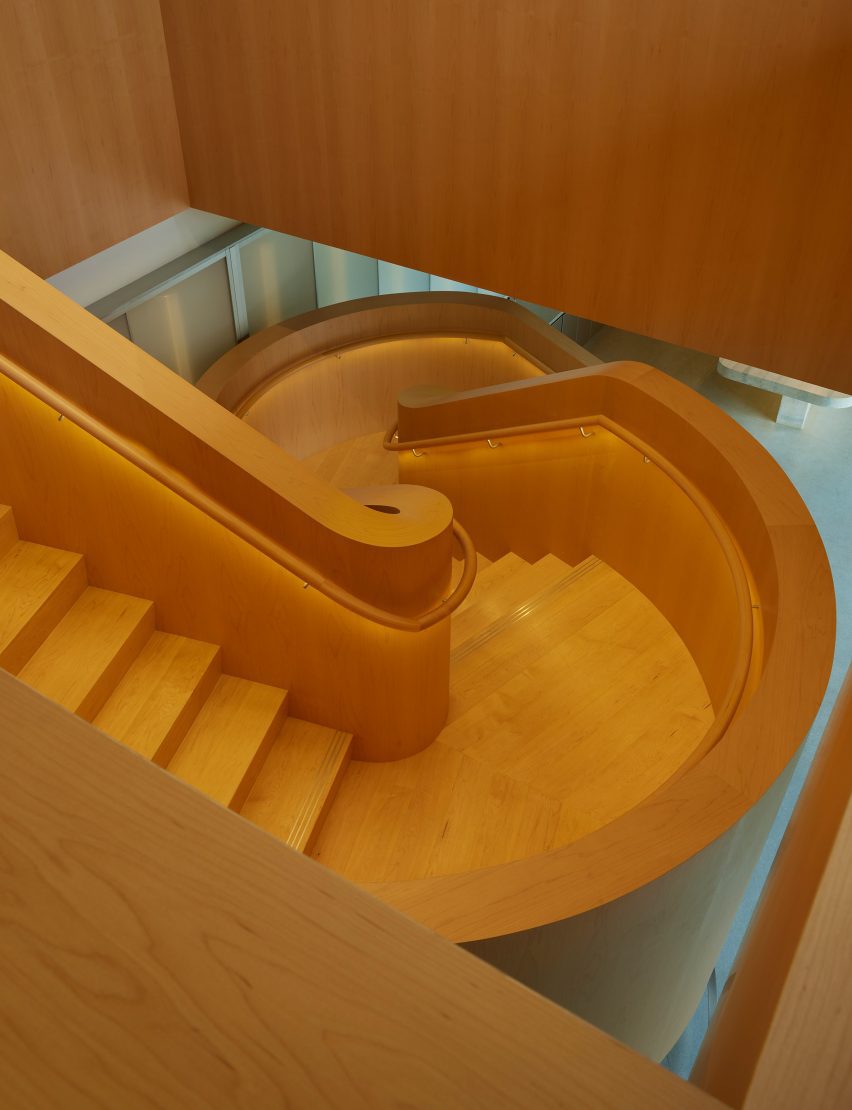 An all-wood staircase snakes upward