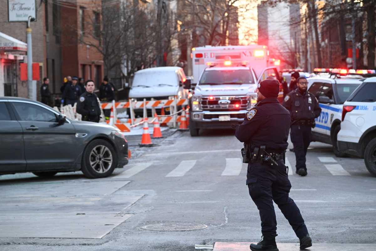 Police at scene of Queens homicide where man was shot dead.