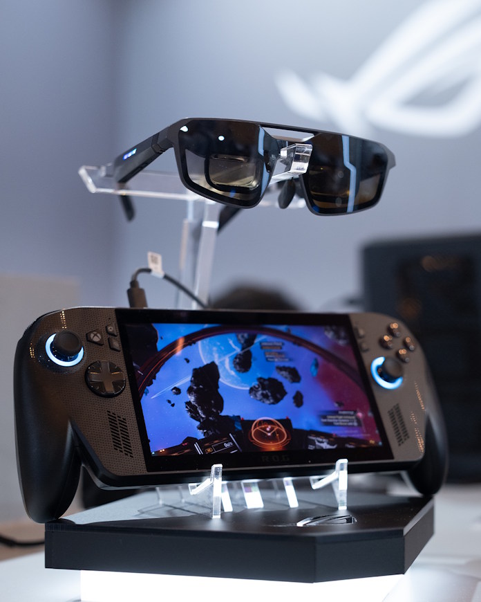 A display showing the ROG XREAL R1 gaming glasses and the ROG Xbox Ally X