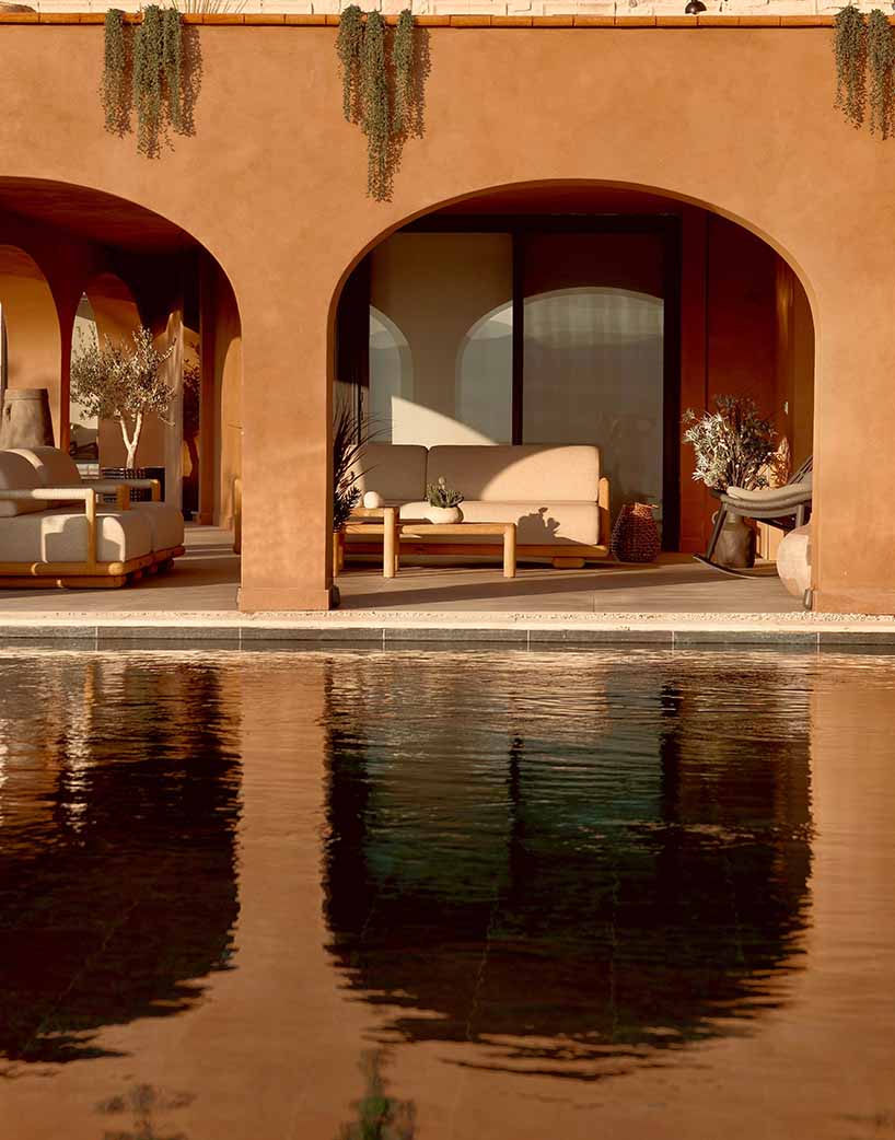 lime-washed facade in terracotta tones enfolds urla family home in turkey