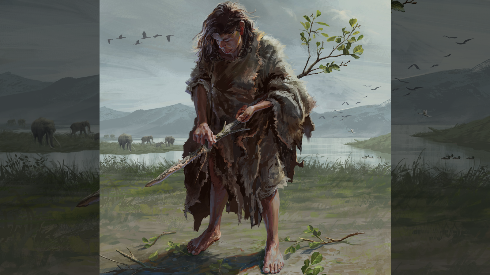 An illustration of a Stone Age person with long brown hair who is standing on a grassy area by a river, which has elephants and birds in the background. The person is holding and de-barking a branch.