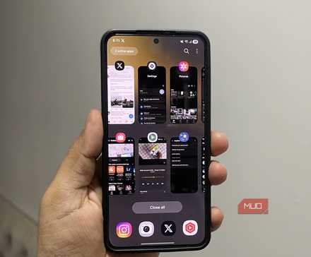 Samsung Galaxy phone in hand showing recents menu