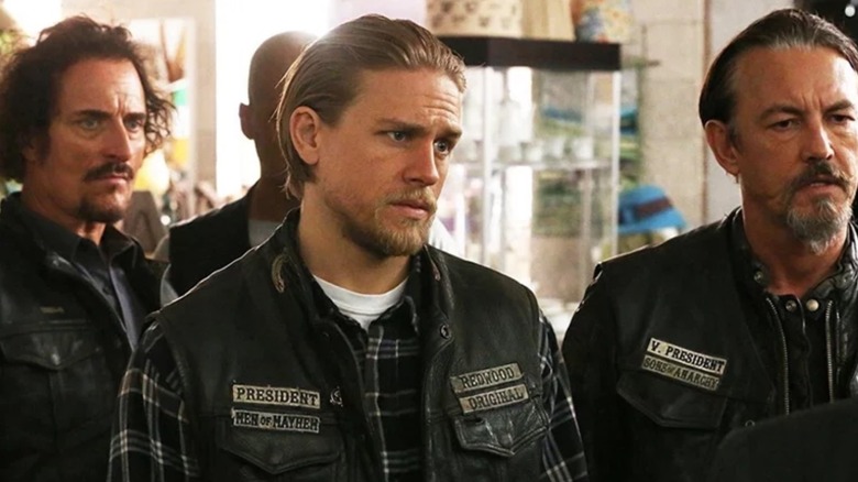 Tig (Kim Coates), Jax (Charlie Hunnam) and Chibs (Tommy Flanagan) stand together in SAMCRO biker jackets in Sons of Anarchy