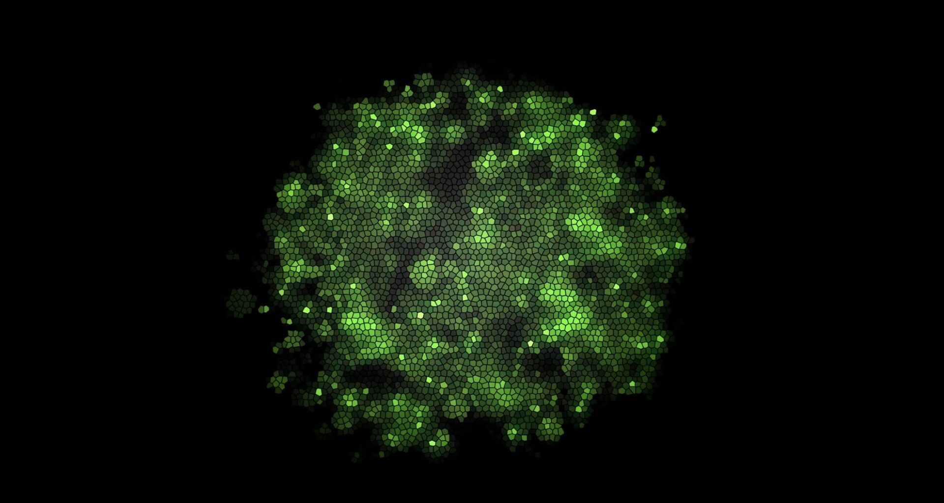 Sparkling Green Mosaic Cells Creating An Abstract Organic Shape Against A Dark Background