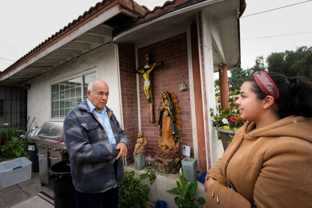 On Thursday, Jan. 22, 2026, in San Diego, Carlos Ramirez and his daughter, Cristal Ramirez, 29 talk about how high the water was outside their home onYama Street, where the water rose as high as 7 ft during the flood in January 2024. (Nelvin C. Cepeda / The San Diego Union-Tribune)