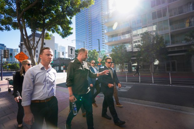 Josh Coyne with the Downtown San Diego Partnership led Assemblymember Matt Haney on a brief tour of City Center in downtown San Diego on Nov. 13, 2024.  (Nelvin C. Cepeda / The San Diego Union-Tribune)