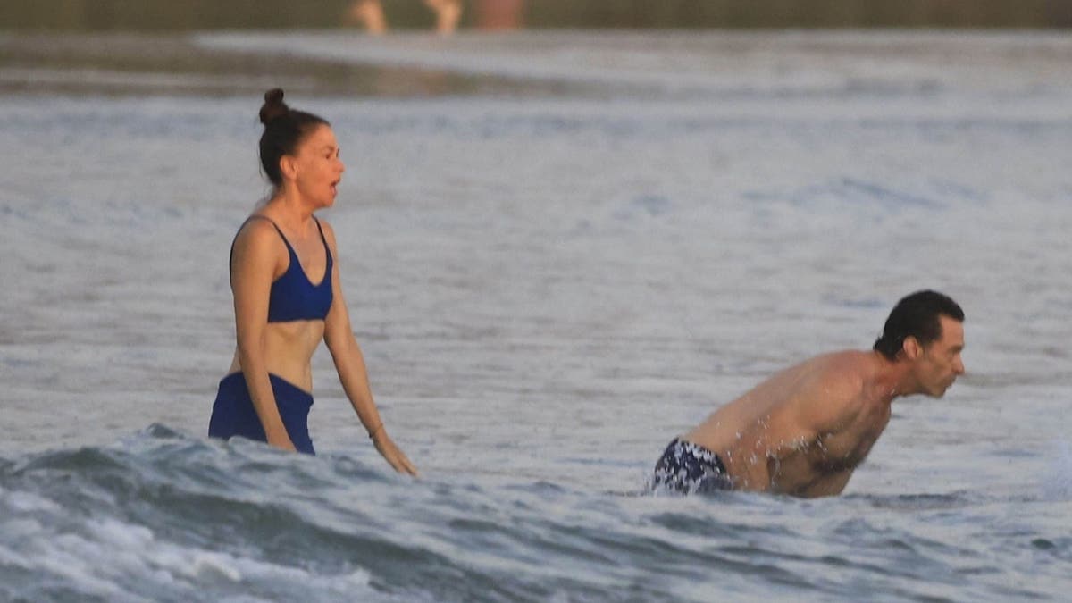 Sutton Foster and Hugh Jackman in the waves