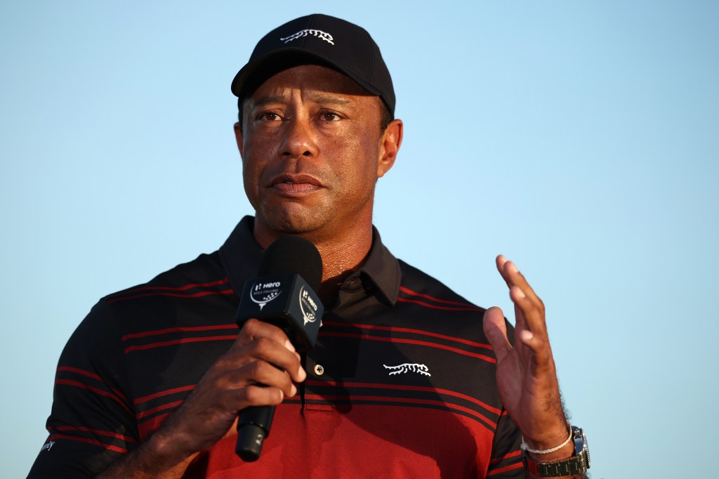 Tiger Woods of the United States speaks during the trophy presentation on the 18th green after the final round of the Hero World Challenge 2025 at Albany Golf Course on December 7, 2025 in Nassau, Bahamas.  