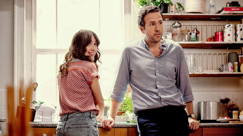 Esther Smith as Nikki and Rafe Spall as Jason sit in a kitchen in Trying