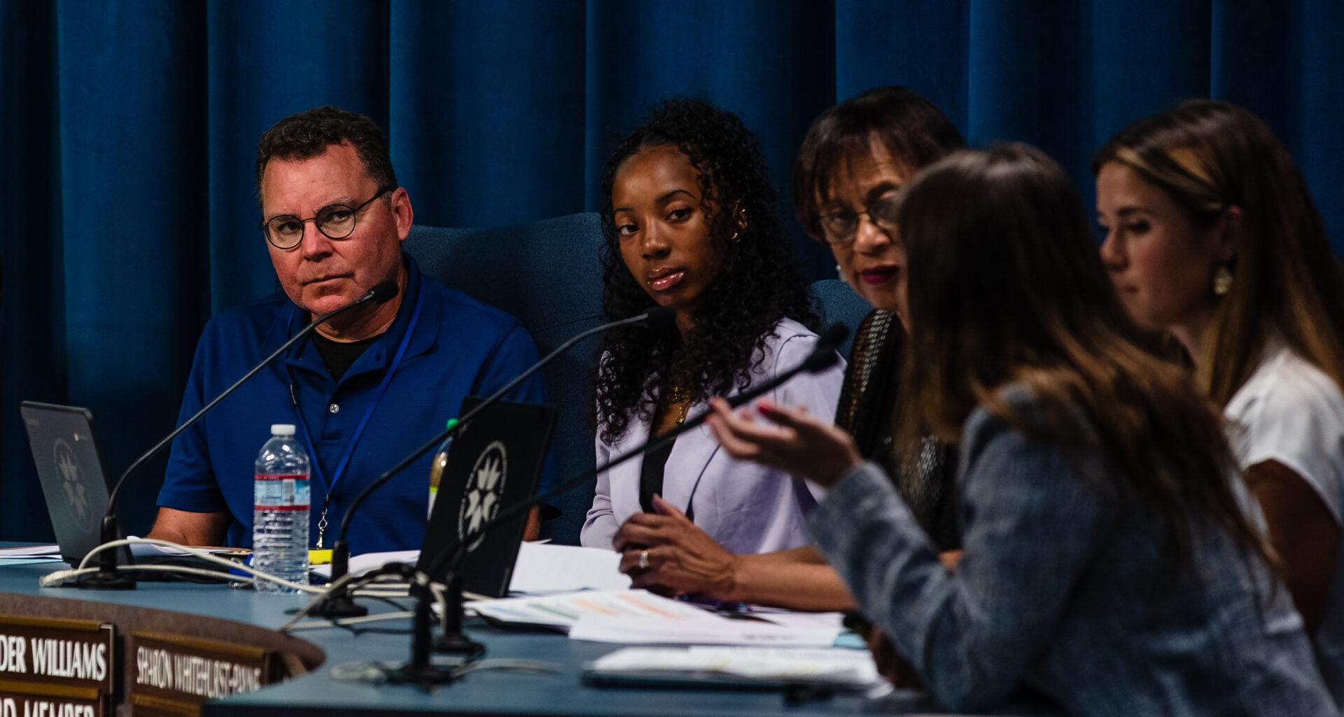 (From left to right) Board Trustee Richard Barrera, Student Board Member Blessyn Lavender Williams and District E Board of Education Trustee Sharon Whitehurst-Payne during a San Diego Unified School District meeting in University Heights on July 11, 2023.