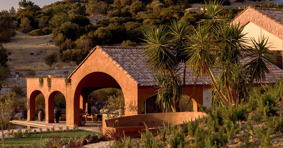 lime-washed facade in terracotta tones enfolds urla family home in turkey