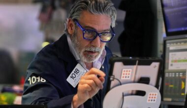 Wall Street ticks to records after shaking off worries about Trump's feud with the Fed