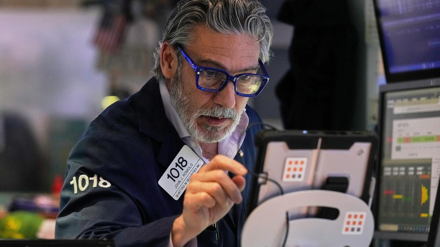 Wall Street ticks to records after shaking off worries about Trump's feud with the Fed