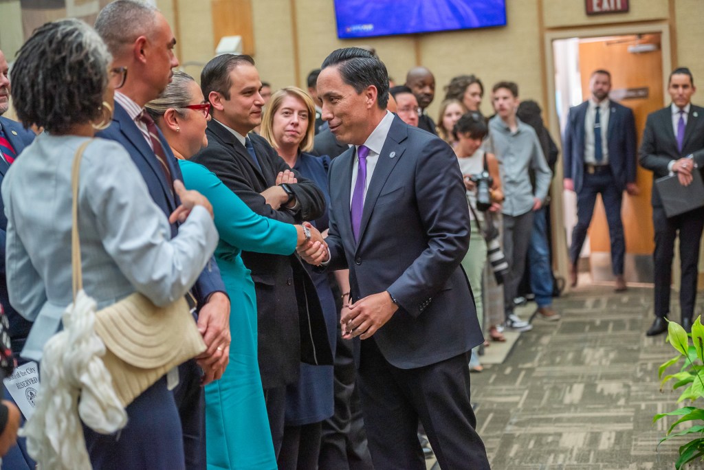 San Diego Mayor Todd Gloria shakes hands with Councilmember Vivian Moreno after delivering his State of the City speech on Wednesday, Jan. 15, 2025. / Photo by Vito di Stefano for Voice of San Diego