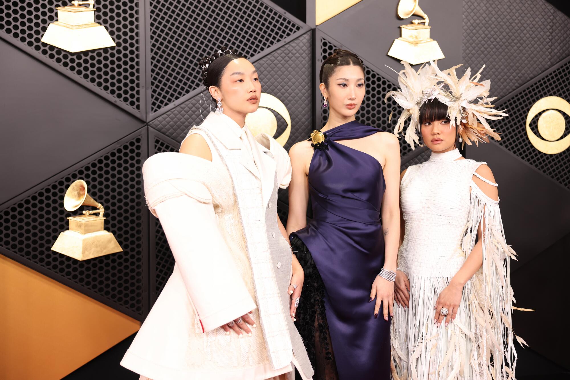  Audrey Nuna, Ejae and Rei Ami pose on the red carpet. 