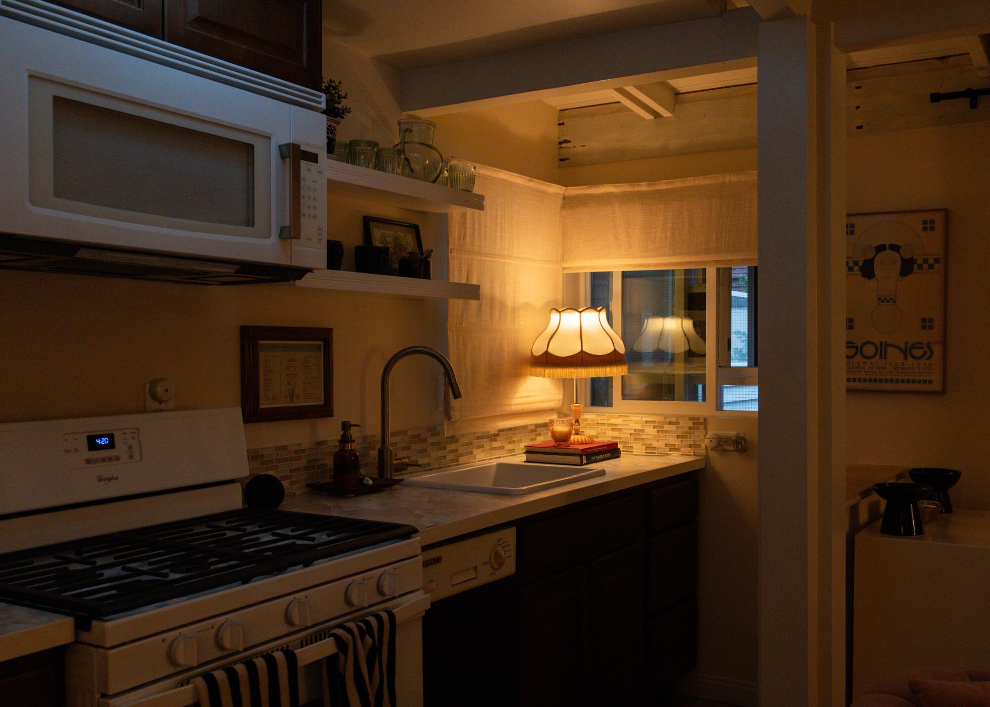 The corner nook of Tori Adams' kitchen is illuminated by a warm lamp.