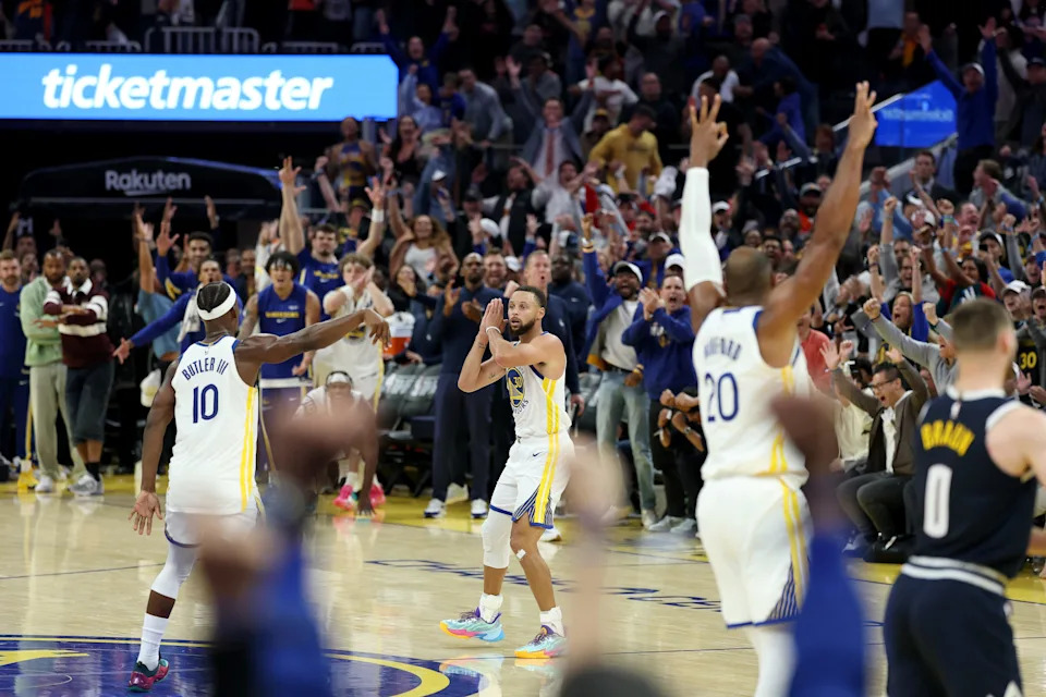 SAN FRANCISCO, CALIFORNIA - OCTOBER 23: Stephen Curry #30 of the Golden State Warriors does his "night night" celebration after Jimmy Butler III #10 made a three-point basket against the Denver Nuggets in overtime at Chase Center on October 23, 2025 in San Francisco, California. NOTE TO USER: User expressly acknowledges and agrees that, by downloading and/or using this photograph, user is consenting to the terms and conditions of the Getty Images License Agreement. (Photo by Ezra Shaw/Getty Images)