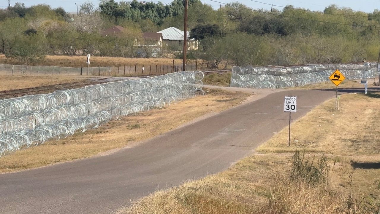Military razor wire fence installed in RGV neighborhood